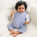 20-inch realistic reborn baby doll with deep skin tone, curly hair, and striped overalls - Cloth Body Style