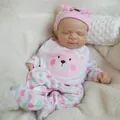 Lifelike 18-inch soft silicone reborn baby doll in pink bear outfit on cozy white fleece - Pink Bear Style (18寸FBBD-020实心)