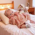 Realistic 18 inch reborn baby doll Bettie in floral pink dress with lace accessories - Cloth Body Style / Pink Floral / 18 inch
