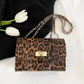 Retro leopard print crossbody bag with gold chain strap and metallic turn-lock closure - Brown