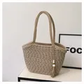 Close-up of the textured cotton rope weave and boho tassel on this woven tote bag - Khaki with Pendant