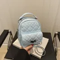 Light blue quilted mini backpack with silver metal chain straps and front flap pocket - Light Blue