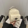 Elegant cream white quilted mini backpack with a stylish silver chain strap for women - Light Yellow