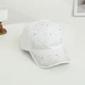 Close-up of sparkling colorful rhinestones and silver star crystals on a white baseball cap - One Size / White