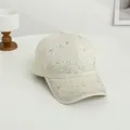 Detail of cream-colored baseball cap featuring colorful star rhinestones on cotton canvas - One Size / Beige