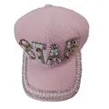 Close-up of pink STAR newsboy cap featuring luxury rhinestones and pearl embellishments - STAR Letter Style / Pink