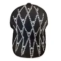 Detailed view of black knitted baseball cap with rhinestone and pearl diamond patterns - Cross Rhinestone Pattern / Black