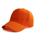 Detail view of the vibrant orange five-panel baseball cap with reinforced stitched brim - Adjustable / Orange