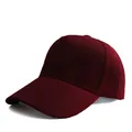 Detailed close-up of dark burgundy cotton twill fabric and stitching on a baseball cap - Adjustable / Burgundy