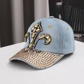 Denim baseball cap with yellow crystal fleur-de-lis and rhinestone brim for sun protection - Adjustable / Light Blue