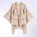Detailed view of beige and brown checkered poncho with fringe trim and soft knit texture - 130*150cm / Beige Plaid With Tassels