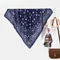 Classic dark blue paisley silk scarf with polka dot border on a white hanger - Navy Blue