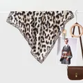 Fashionable leopard print silk scarf for women displayed with stylish brown accessories - 70x70cm / Border Leopard Beige Khaki