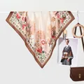 Detail of silk square scarf with red floral patterns and elegant dark brown border - Peony