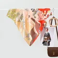 Elegant silk scarf with artistic oriental landscape print and warm yellow tones - Dusk Sea Orange