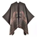 Close-up of olive green cashmere-style knitted poncho with symmetric horse motifs - 135x155cm / Dusty Pink