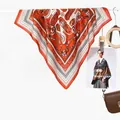 Vintage orange paisley geometric silk square scarf draped with elegant texture and drape - Chain Scroll Pattern Orange Red
