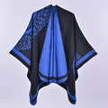 Detail of royal blue and black knit poncho with intricate geometric patterns - Double Sided Sunflower Blue Black