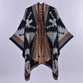 Detail of bohemian knit shawl with geometric Aztec patterns and black hemmed edges - Ethnic Cross Border Black White