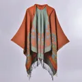 Close-up of knit hooded poncho featuring floral jacquard and black fringed tassels - Hooded Tassel Cartoon Floral Orange / 130x150cm