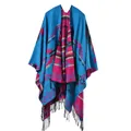 Detailed view of bohemian geometric pattern knit poncho with black tassel fringe - Blue Geometric