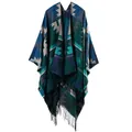 Detail of geometric knit poncho featuring ethnic diamond patterns and black fringe trim - Indian Green
