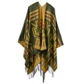 Close-up of geometric ethnic patterns and thick black tassel fringe on the shawl - Cross Plum Yellow