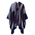 Detail of color block knit poncho showing navy and burgundy geometric patchwork - Coffee