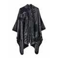 Detail of grey paisley knit shawl showing thick texture and bohemian pattern design - Paisley Black Gray