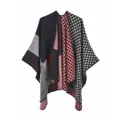 Detail of color-block poncho with checkerboard patterns and reinforced edges - One Size / Color Block Black Red