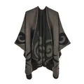 Detailed close-up of brown knit poncho with black spiral patterns and stitched edges - 130*150cm / Vintage Khaki Cloud