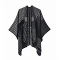 Detail of the knit texture and geometric pattern of the grey double-sided poncho cape - Black Gray Geometric Stripe