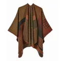 Close-up of bohemian knit poncho featuring colorful geometric patterns and stitching details - Colorful Geometric Patchwork