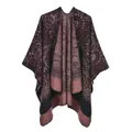 Detail of burgundy paisley knitted poncho with warm fringe edges and ethnic patterns - Wine Red Paisley