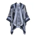 Close-up of knit shawl poncho featuring geometric stripes and blue floral patterns - Comic Sunflower Navy