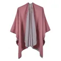 Close-up of pink and grey double-sided shawl with fine knit texture and neat edge binding - Pink