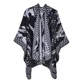 Detail of knit shawl featuring black and white zigzag patterns and abstract textures - One Size / Black And White