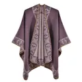 Detail of grey-purple knit poncho showing jacquard patterns and lock-stitch edges - Light Purple