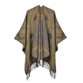 Details des Boho-Strickponchos mit geometrischen Mustern und weichen Quasten am Saum - Gelb Geometrische Quasten