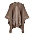 Close-up of thick winter shawl featuring vintage geometric patterns and floral textures - Camel