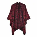 Detailed close-up of vintage red and black flame pattern jacquard knit shawl cape - Flame Auspicious Cloud Black Red