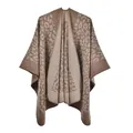 Close-up of leopard print knit texture on faux cashmere poncho with stitched edges - Khaki Leopard