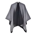 Close-up of dual-tone knit poncho showing grey and black fabric texture and stitched edges - Grey Gradient