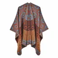 Detailed knit texture of orange and blue geometric pattern shawl with fine edge stitching - Orange