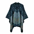 Detail of knitted poncho shawl with bohemian geometric patterns in navy and mustard yellow - Lake Blue