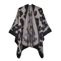 Detailed close-up showing the fine grey leopard print texture of a knit poncho wrap - Large Leopard Black