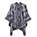 Macro detail of leopard print knit texture on premium oversized women shawl - Large Leopard Grey