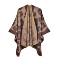 Detail of leopard print knitted poncho featuring thick cashmere-like texture and stitching - Large Leopard Coffee