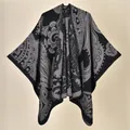 Close-up of ethnic paisley pattern on a soft black and grey knitted winter shawl - Paisley Black Gray