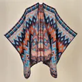 Bohemian geometric knit shawl poncho in vibrant warm tones for travel and camping - 130x150cm / Aztec